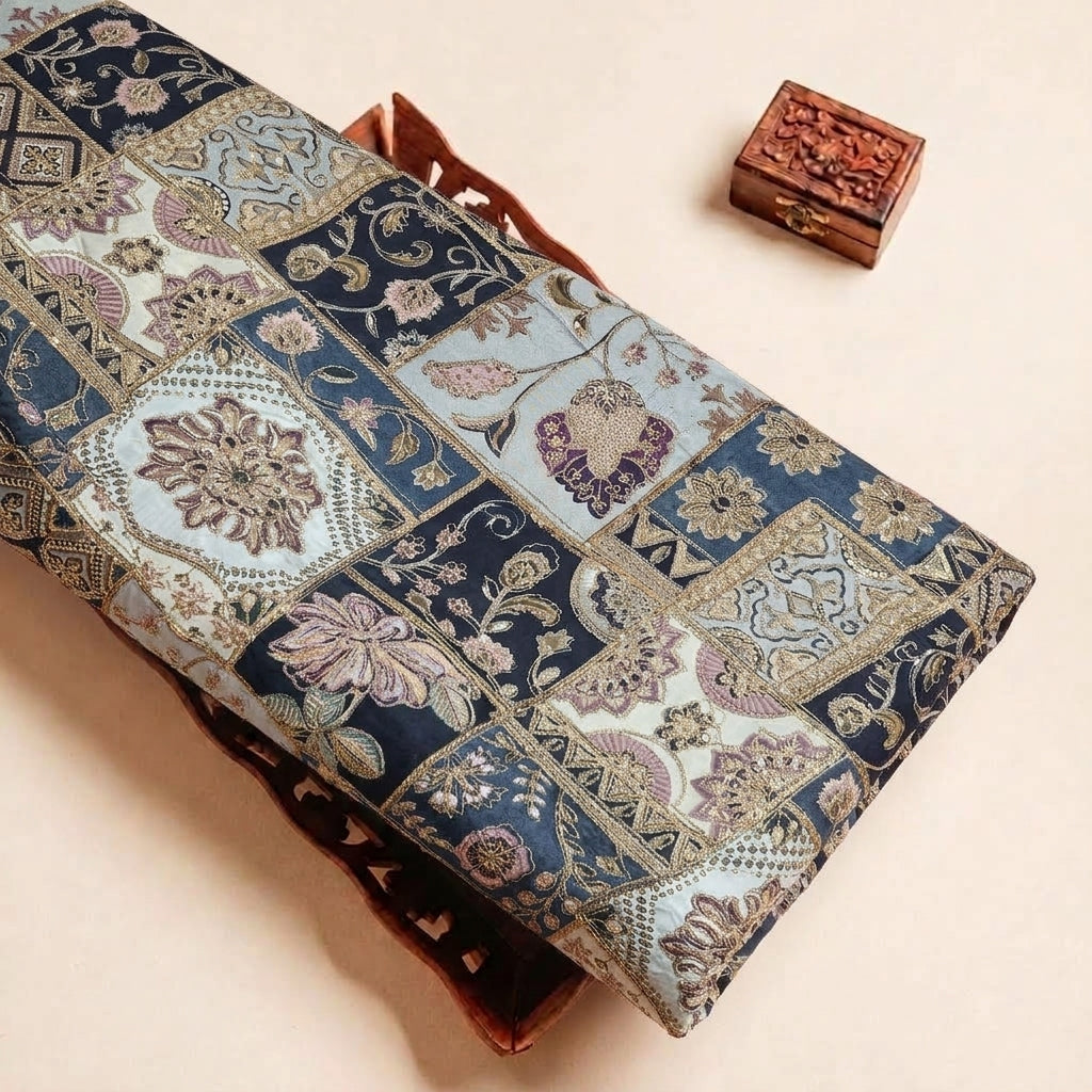 Folded Light Blue Embroidery Crepe Fabric Highlighting Thread Work Stone Sequins and Texture