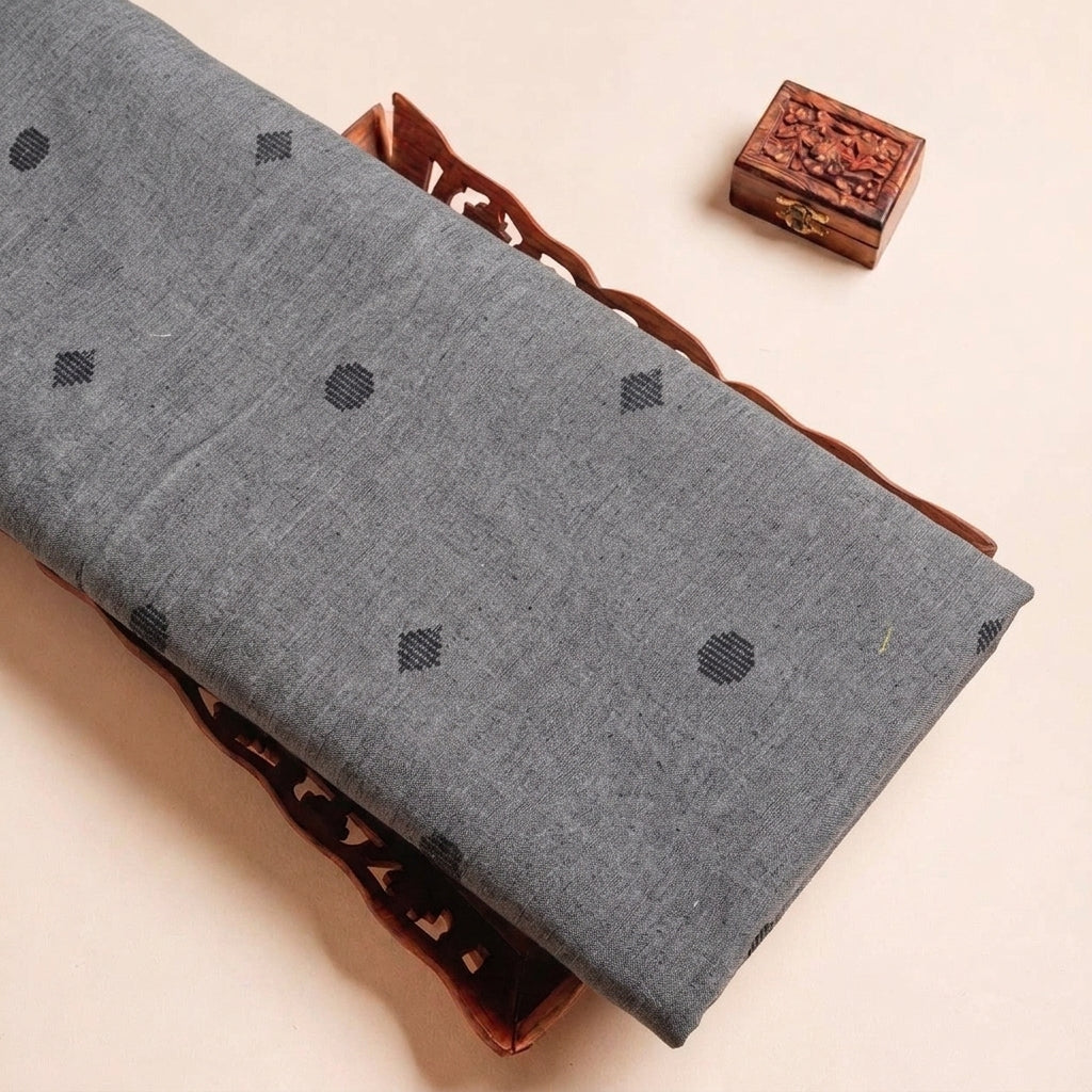 Folded Grey Printed Cotton Fabric Highlighting Texture
