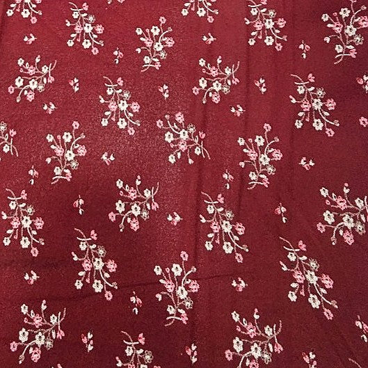 Maroon Floral Rayon Fabric, laid flat