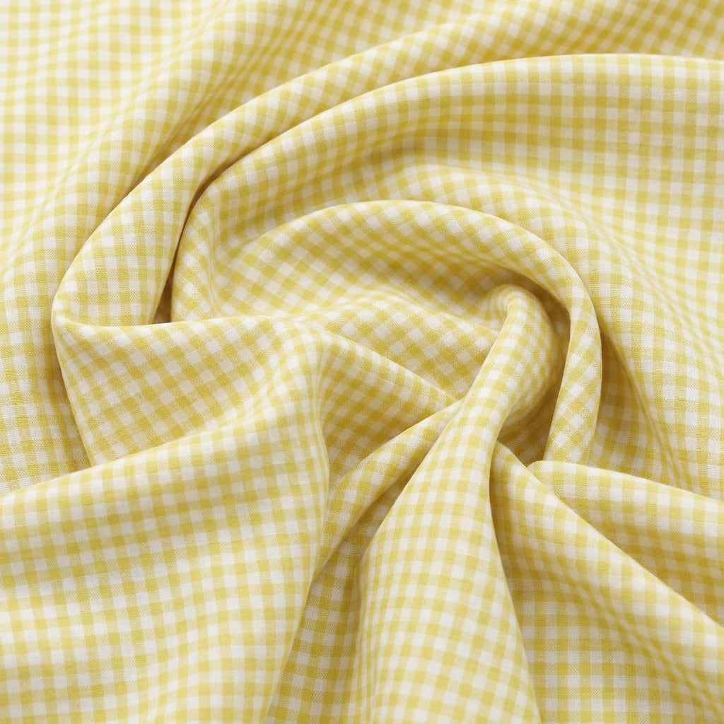 Swirled Light Yellow Checked Cotton Fabric Showing Drape