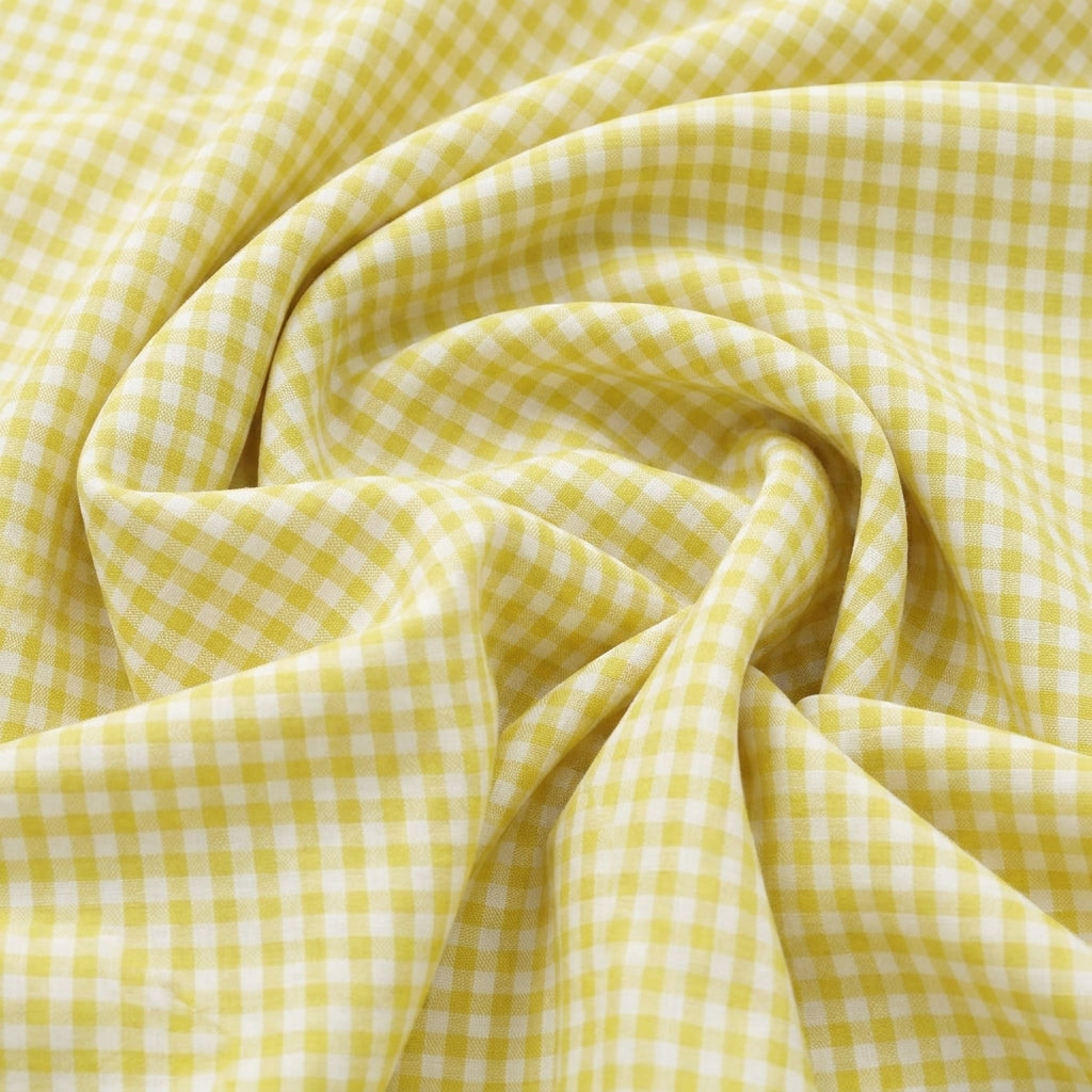 Swirled Yellow Checked Cotton Fabric Showing Drape