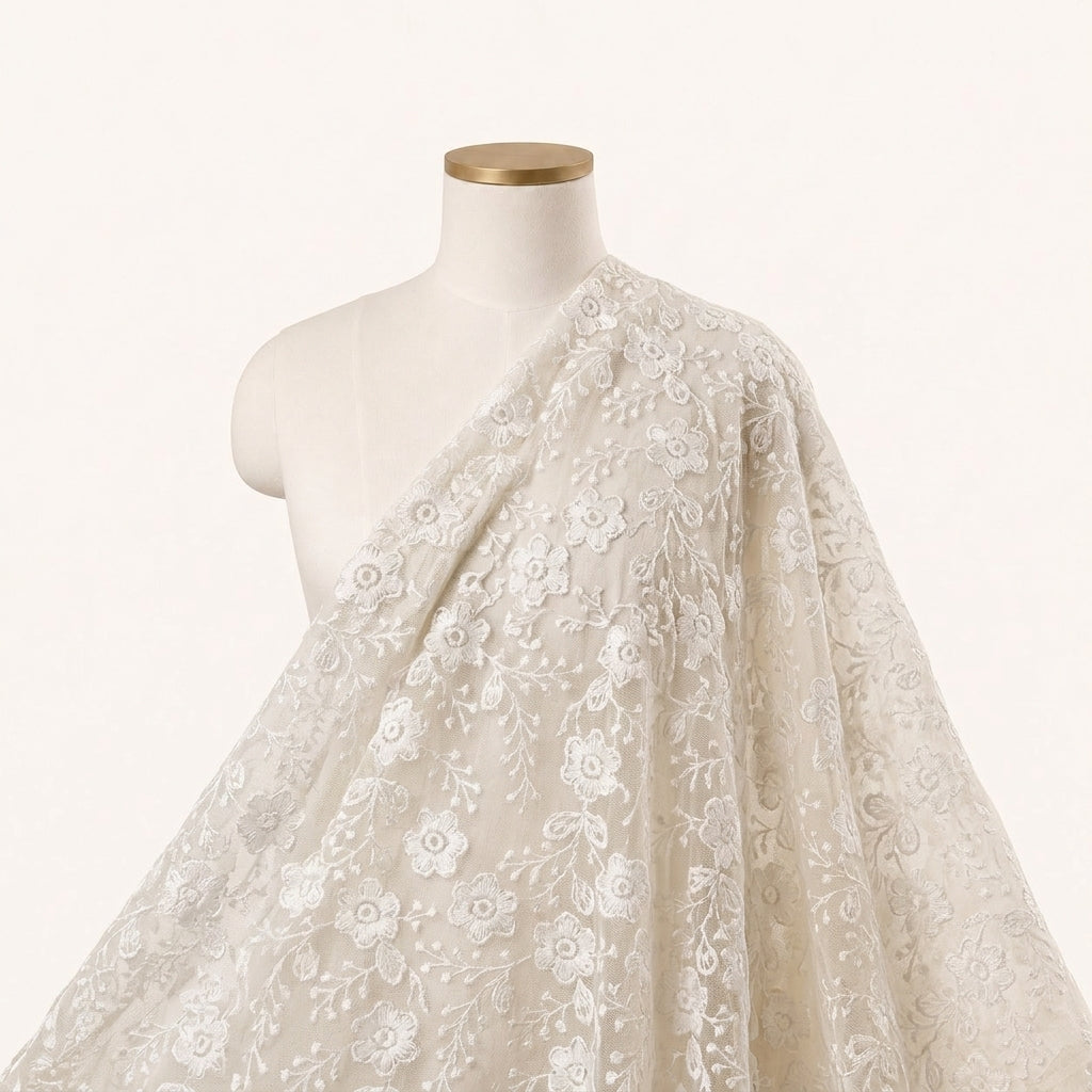 White Embroidery Net Fabric Draped as a saree