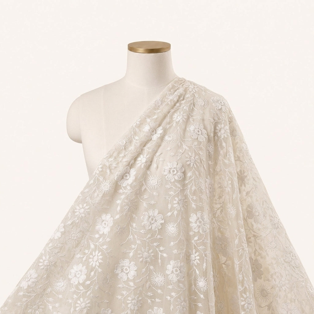 White Embroidery Net Fabric Draped as a saree