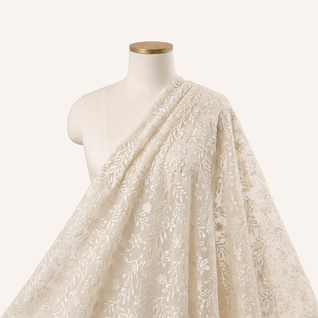 White Embroidery Net Fabric Draped as a saree