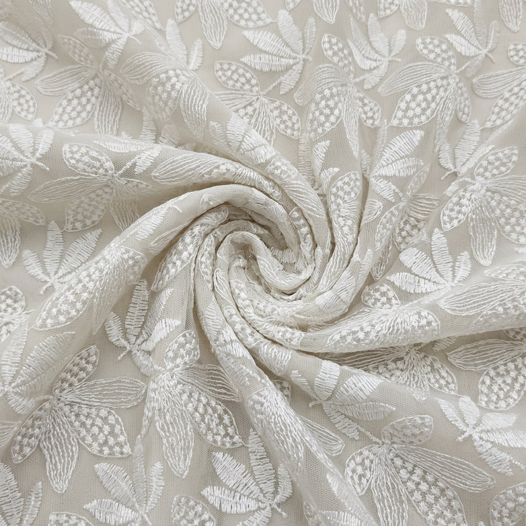 White Embroidery Net Fabric, swirled to show the drape