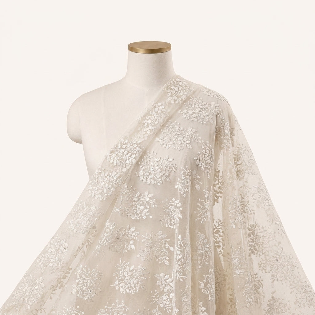 White Embroidery Net Fabric Draped as a saree