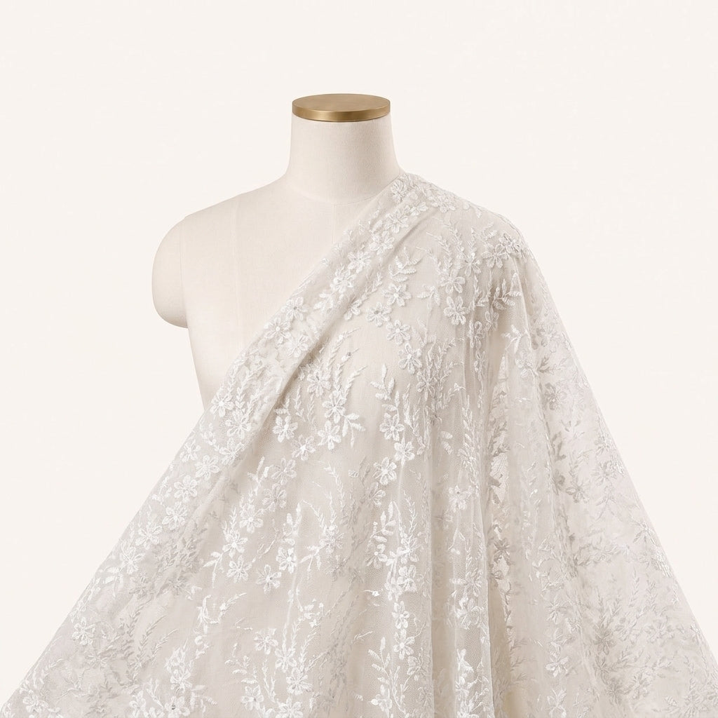 White Embroidery Net Fabric Draped as a saree