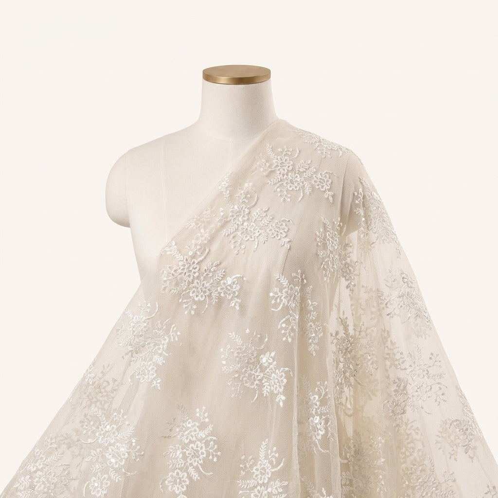 White Embroidery Net Fabric, draped as a saree