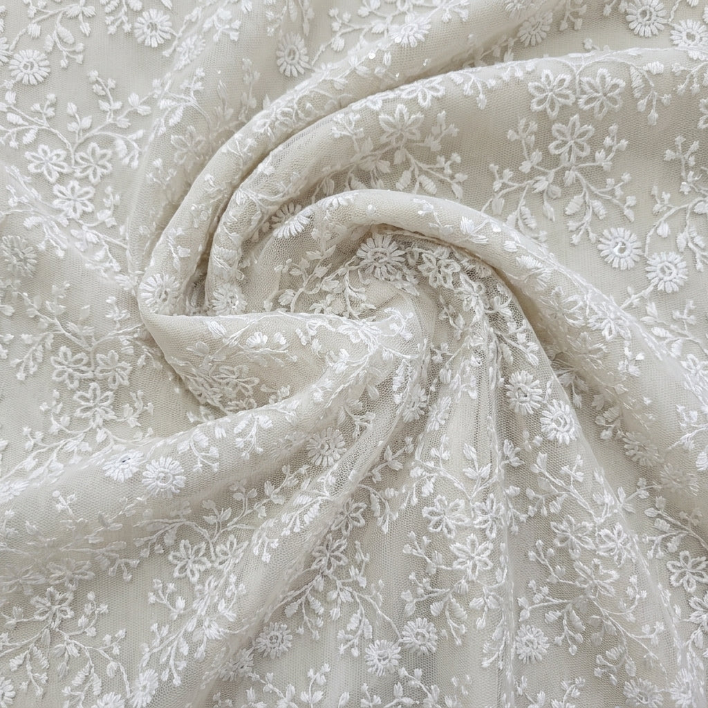 Swirled White Embroidery Net Fabric Showing Floral Sequin Thread Work and Drape