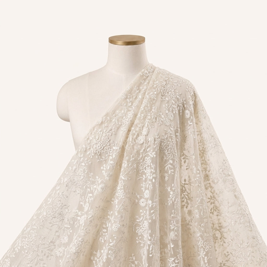 White Embroidery Net Fabric Draped as a saree