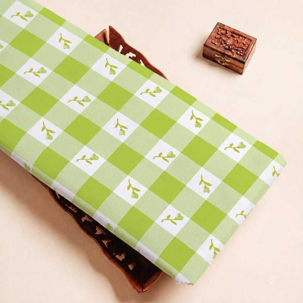 Folded Green Checked Satin Fabric Highlighting Floral and Texture