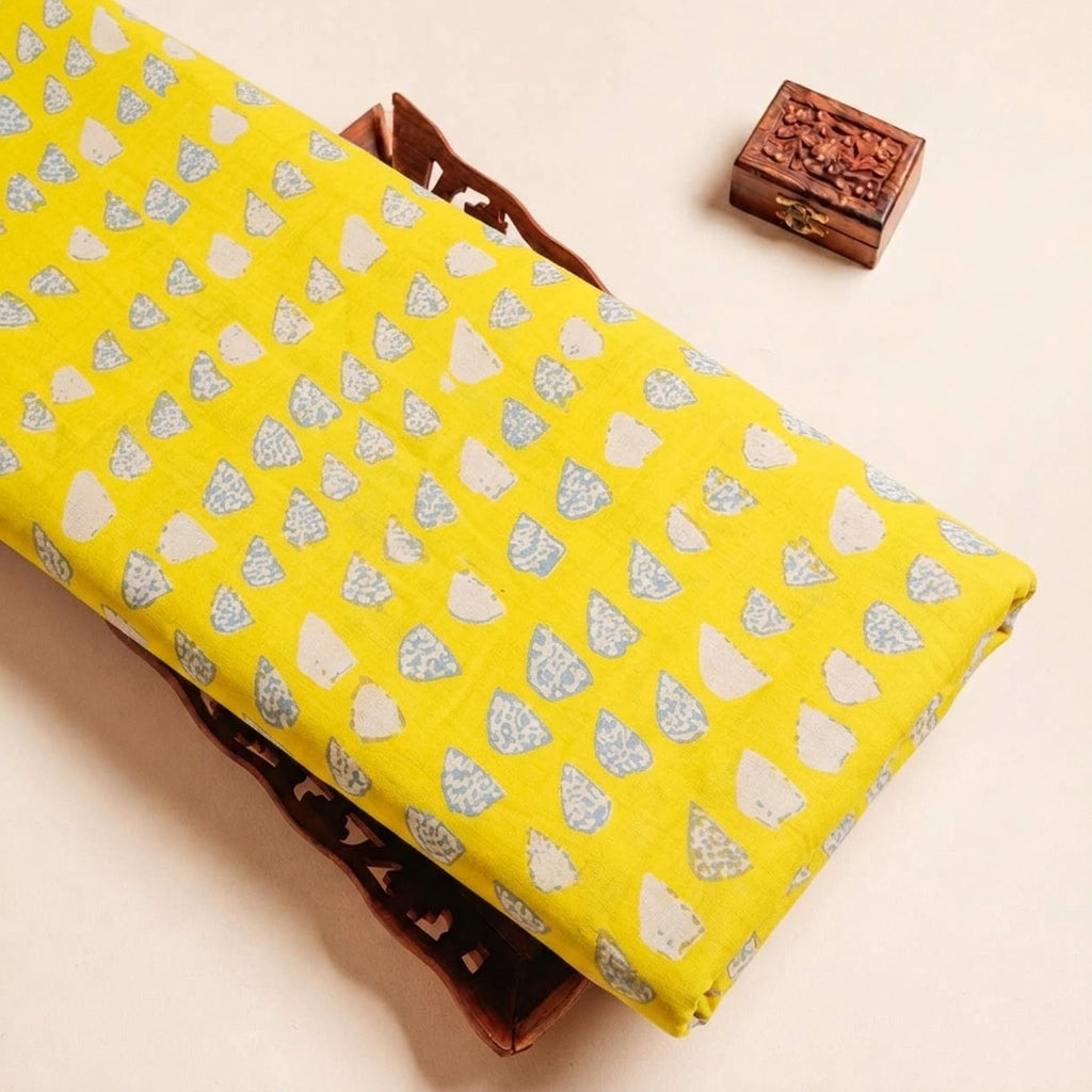Folded Yellow Printed Cotton Fabric Highlighting and Texture