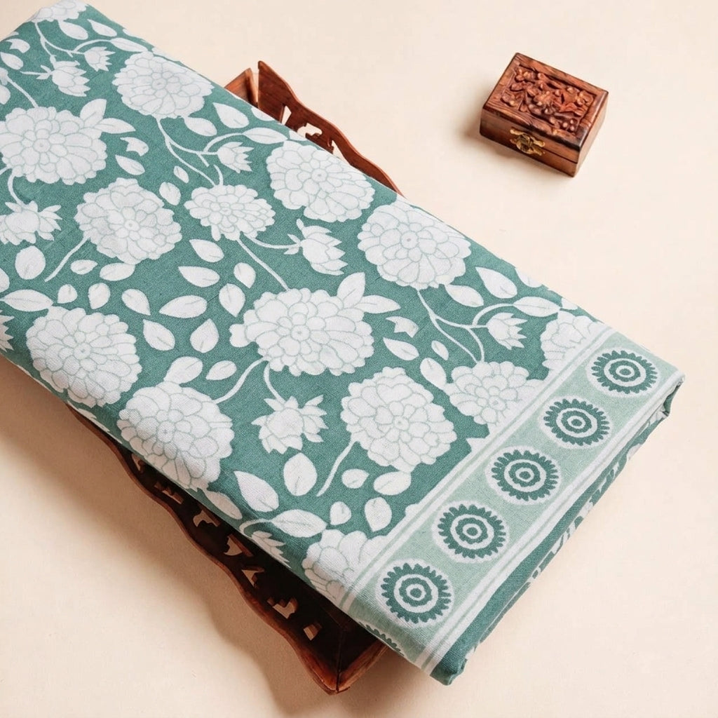 Folded Green Floral Cotton Fabric Highlighting Border and Texture