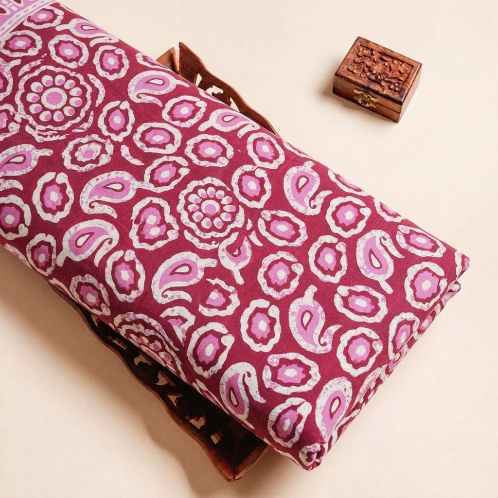 Folded Pink Paisley Cotton Fabric Highlighting Border and Texture