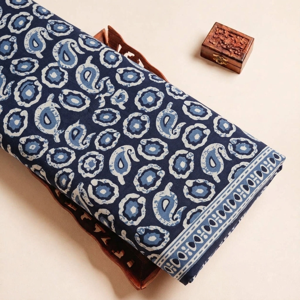 Folded Navy Blue Paisley Cotton Fabric Highlighting Border and Texture