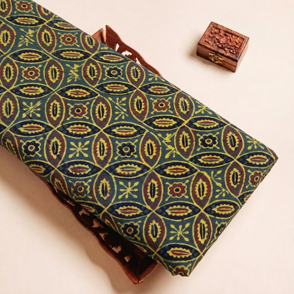 Folded Green Ajrakh Cotton Fabric Highlighting Block Print and Texture