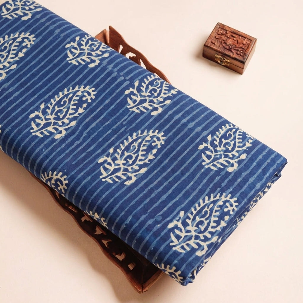 Paisley Indigo Paisley Cotton Fabric on a wooden tray