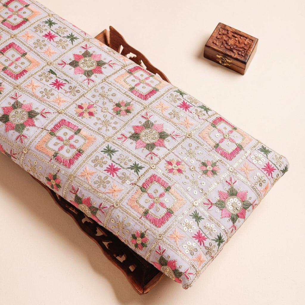 Embroidery White Embroidery Georgette Fabric on a wooden tray