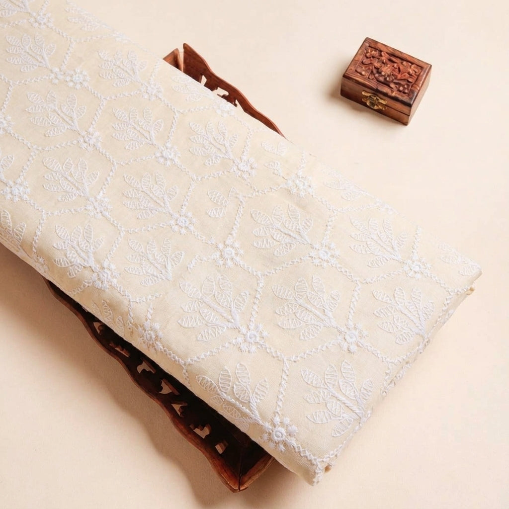 Folded Peach Embroidery Cotton Fabric Highlighting Thread Work and Texture