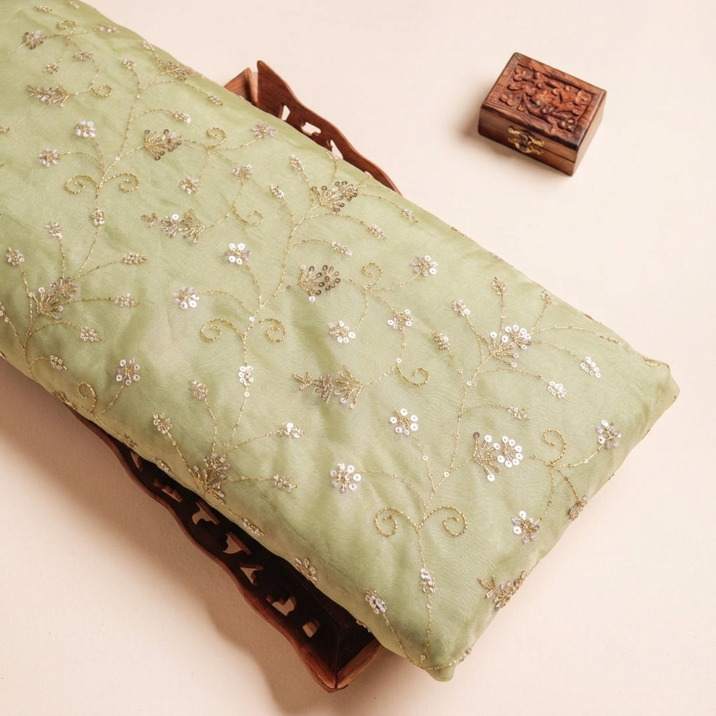 Embroidery Sea Green Embroidery Tissue Fabric on a wooden tray