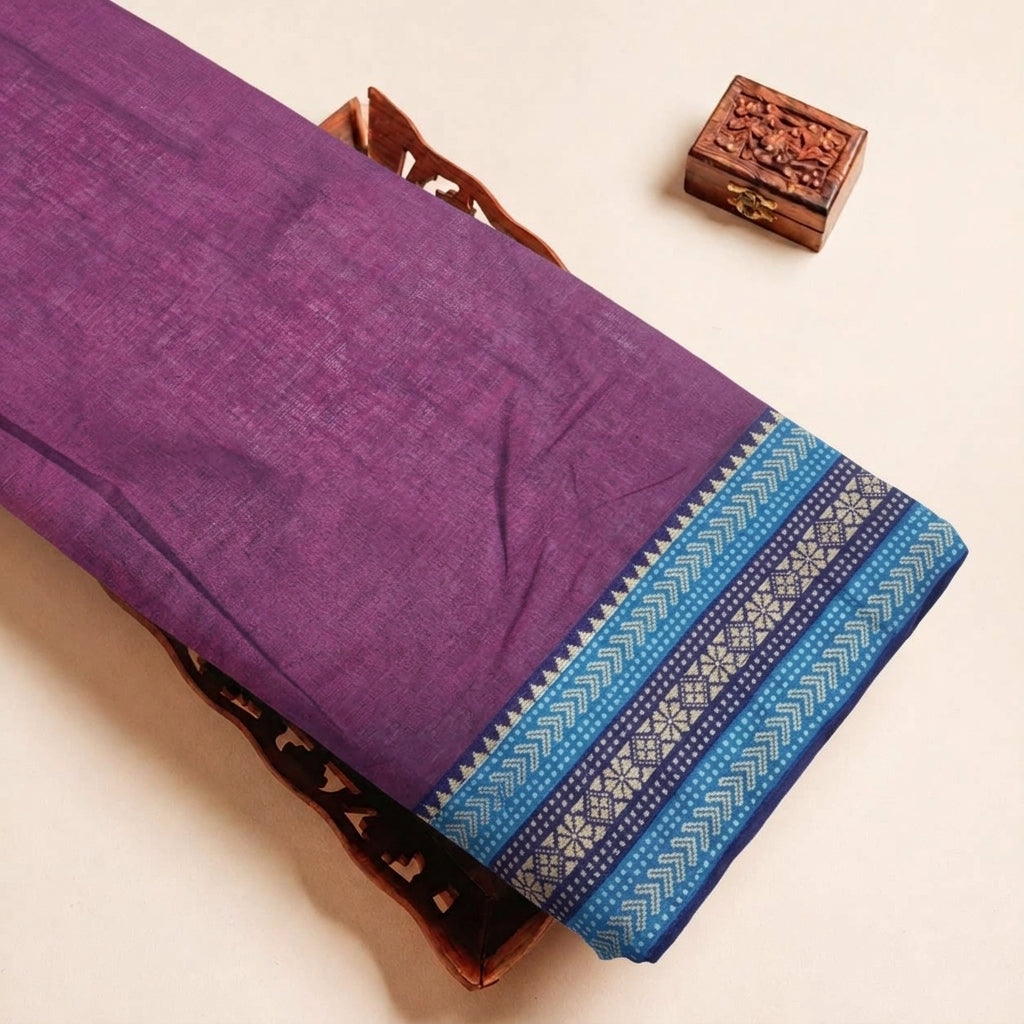 Folded Purple Zari Border Cotton Fabric Highlighting Zari and Texture