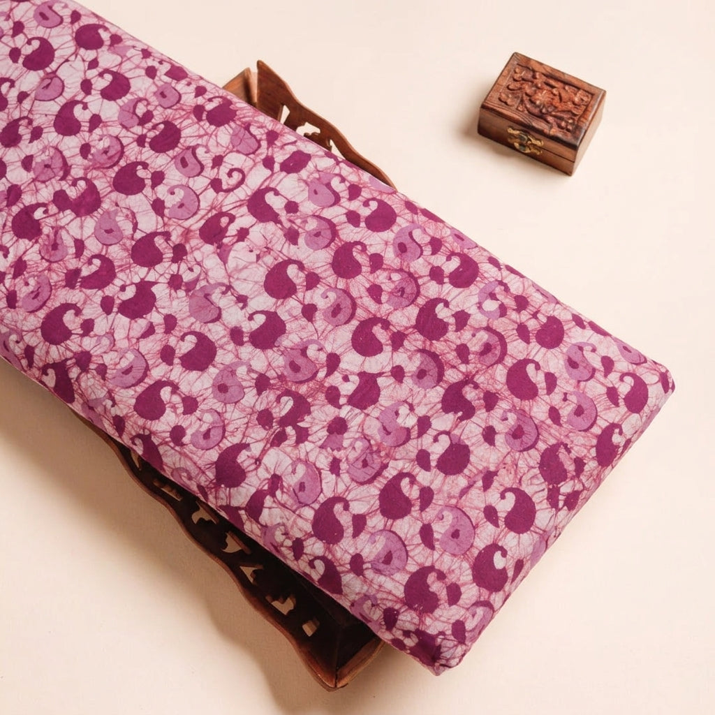 Batik Pink Batik Cotton Fabric on a wooden tray