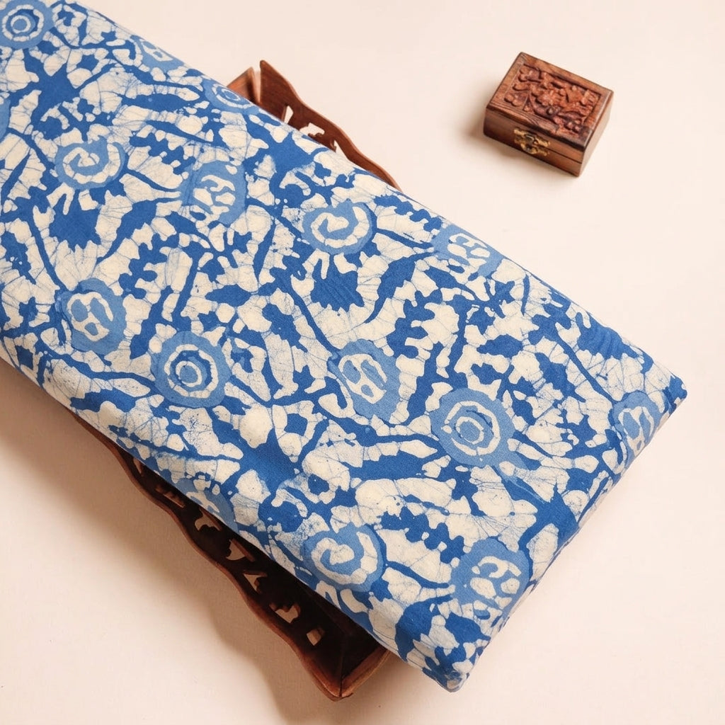 Batik Blue Batik Cotton Fabric on a wooden tray