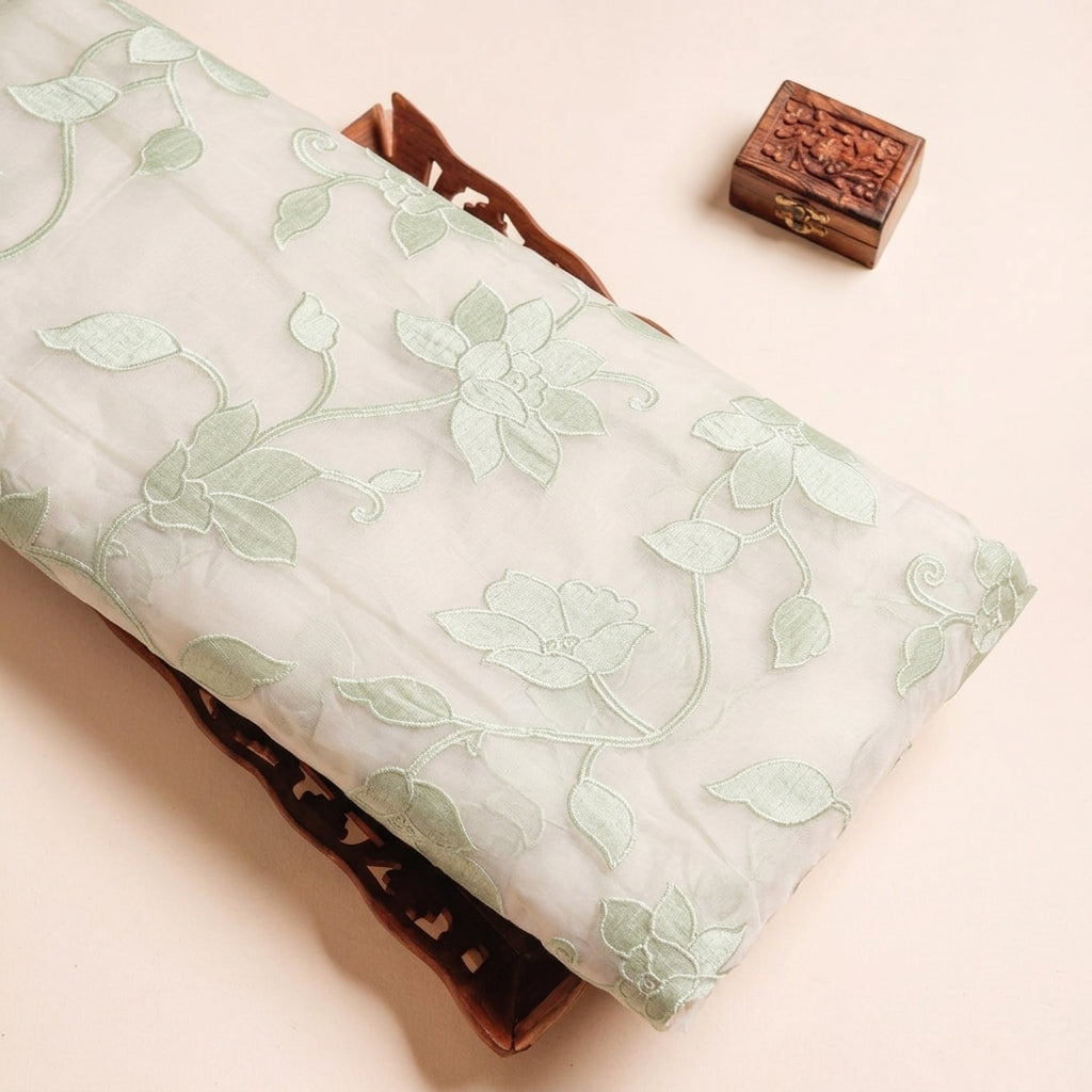 Embroidery Green Embroidery Tissue Fabric on a wooden tray