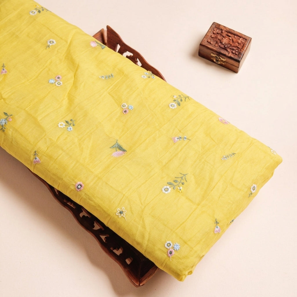 Embroidery Yellow Embroidery Chanderi Cotton Fabric on a wooden tray