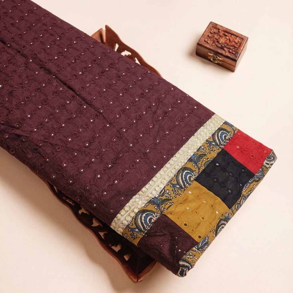 Cutwork Maroon Cutwork Cotton Fabric on a wooden tray