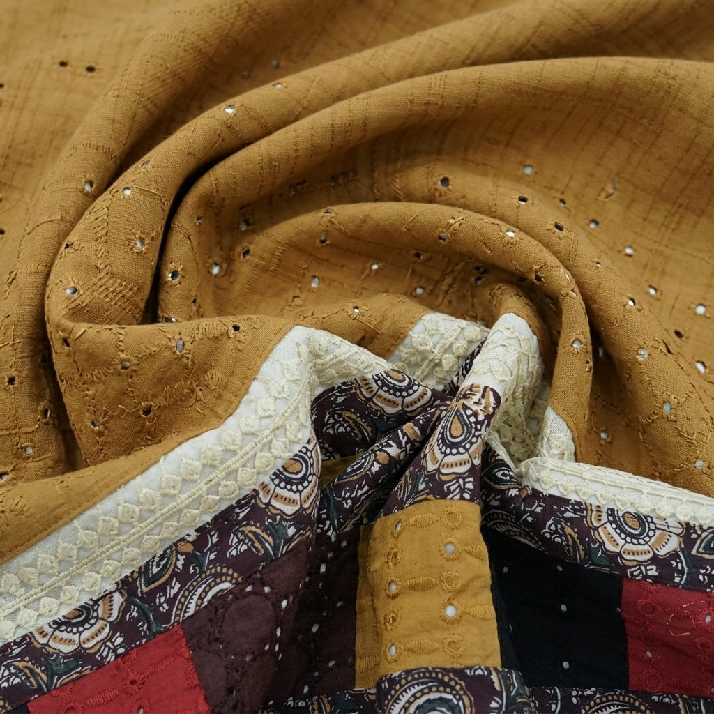 Swirled Cutwork Mustard Yellow Cutwork Cotton Fabric