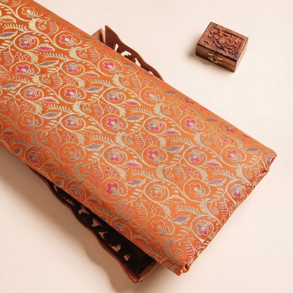 Floral Orange Floral Semi Banaras Fabric on a wooden tray