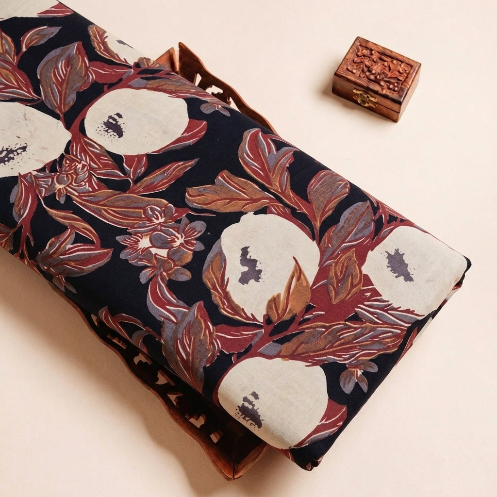 Folded Black Ajrakh Cotton Fabric Highlighting Floral and Texture