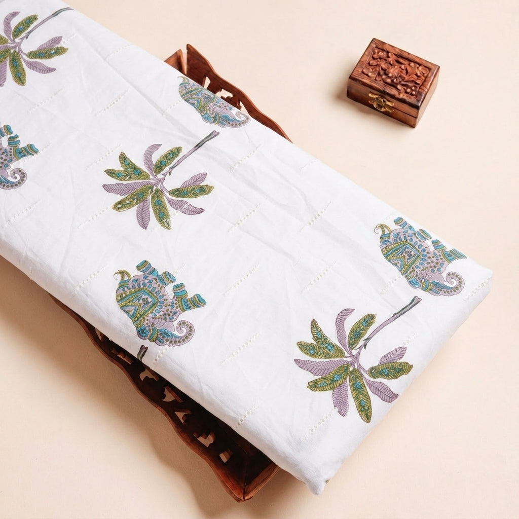 Folded White Embroidery Cotton Fabric Highlighting Thread Work and Texture