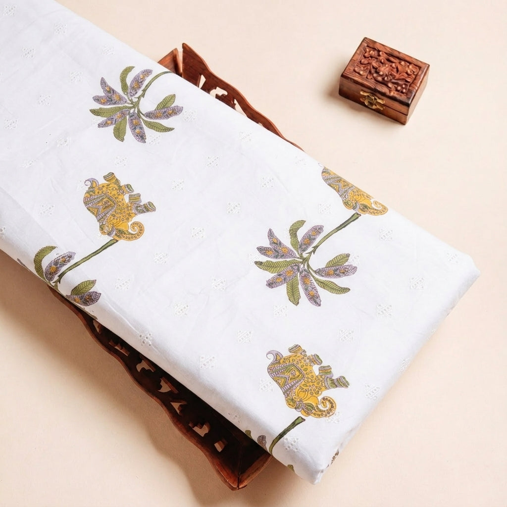 Folded White Embroidery Cotton Fabric Highlighting Thread Work and Texture