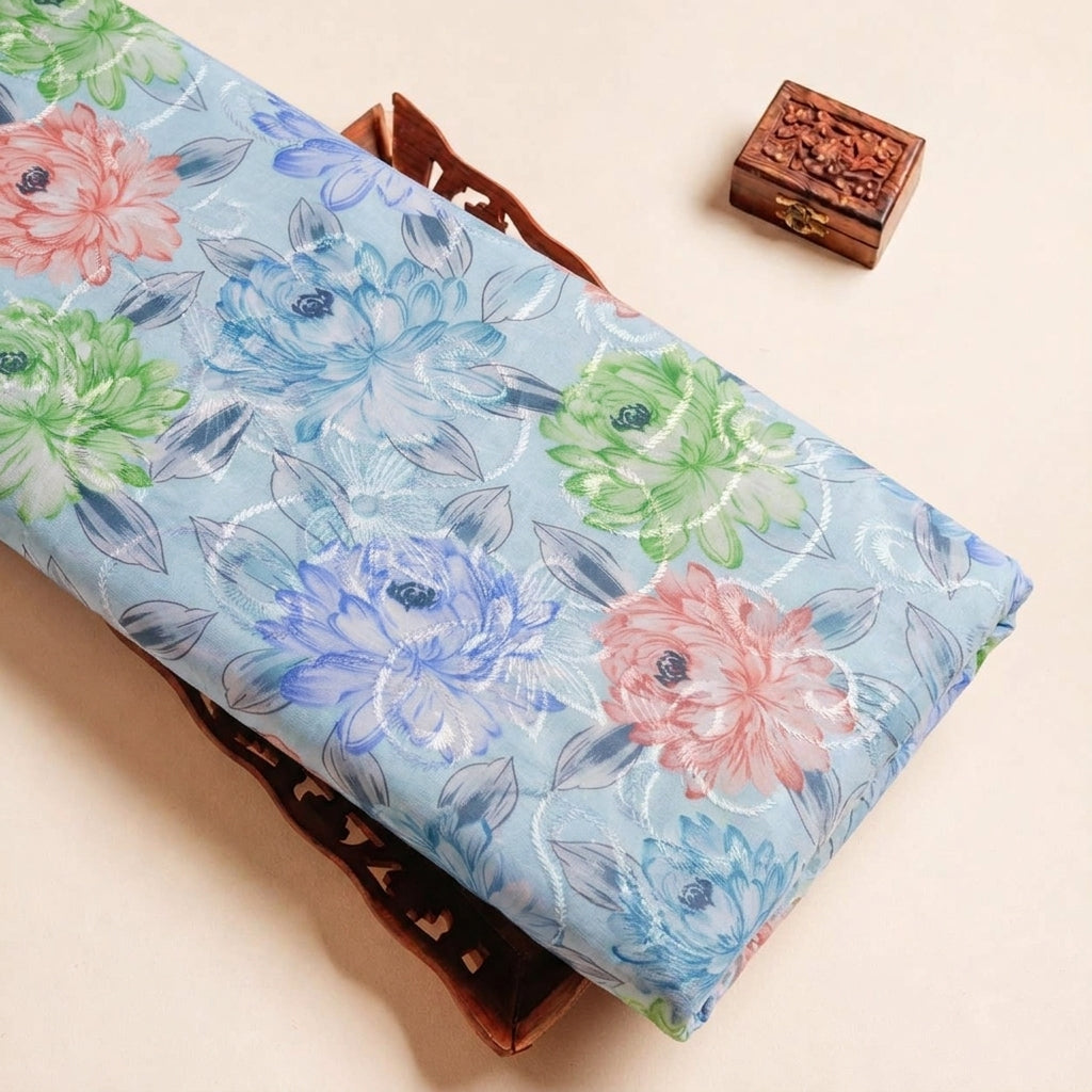 Folded Blue Embroidery Cotton Fabric Highlighting Floral Thread work and Texture