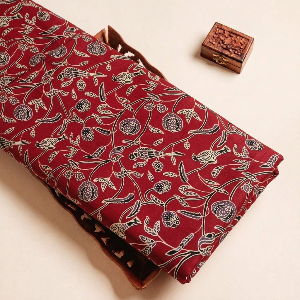 Folded Red Ajrakh Modal Silk Fabric Highlighting Block Print and Texture