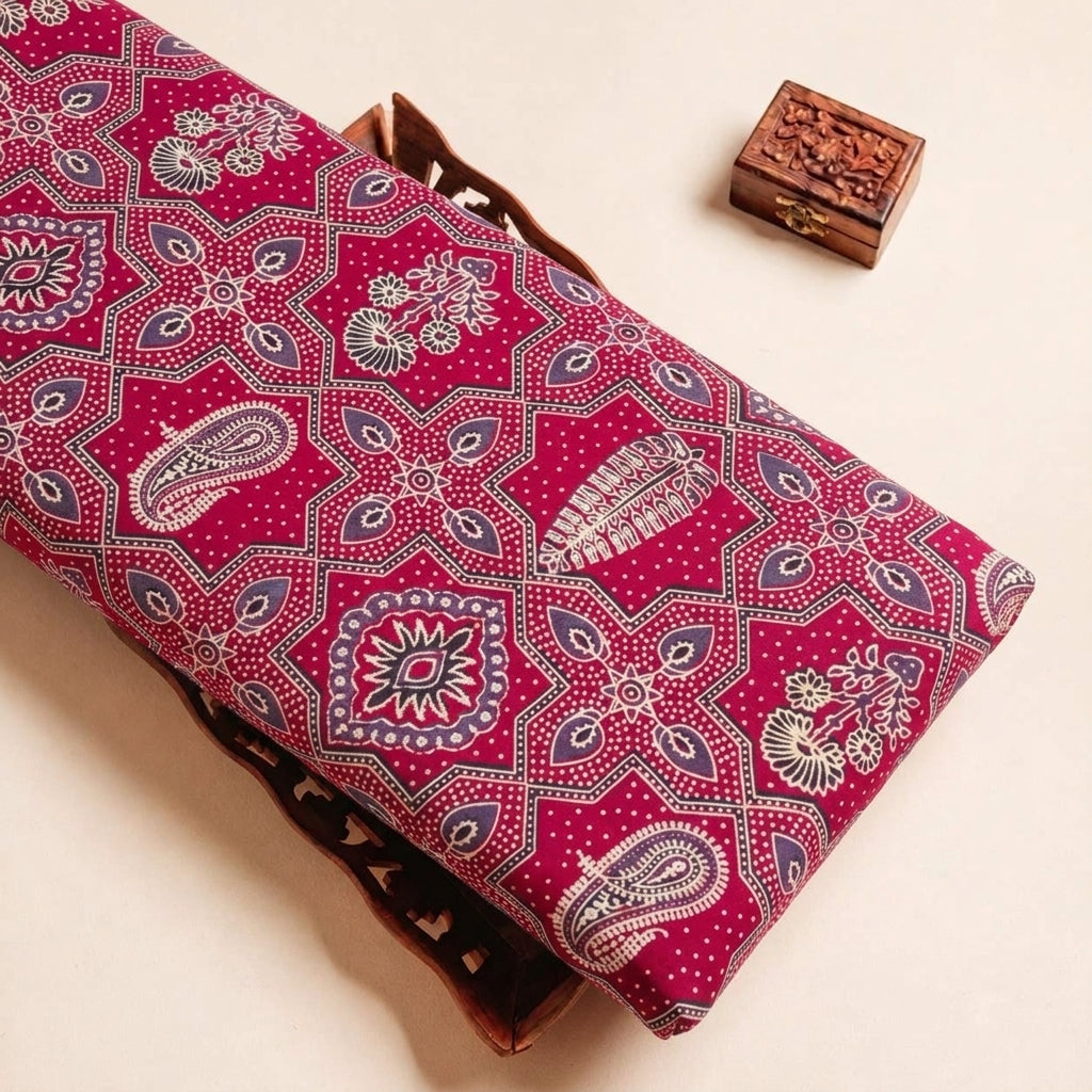 Folded Maroon Ajrakh Modal Silk Fabric Highlighting Block Print and Texture