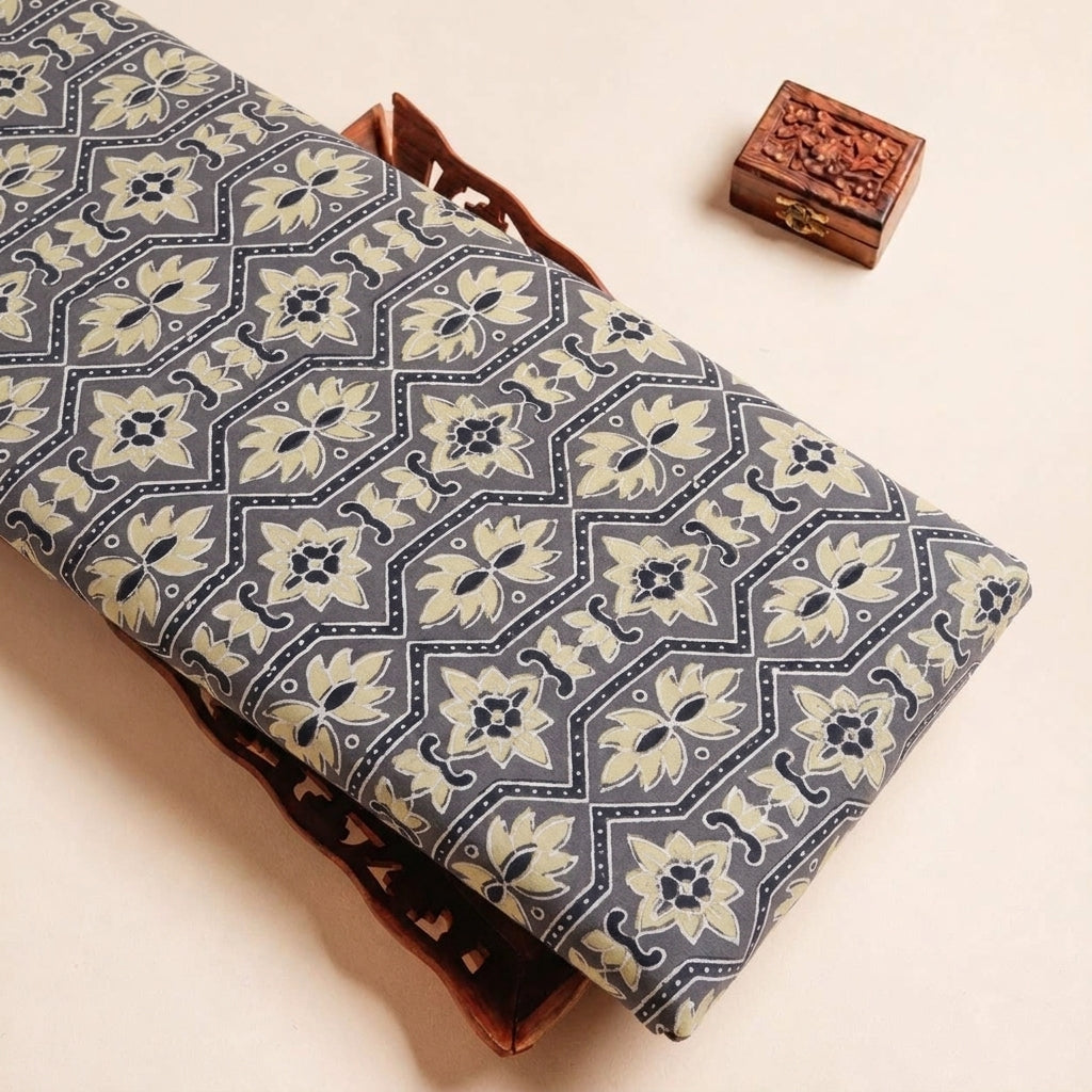Folded Grey Ajrakh Modal Silk Fabric Highlighting Silk Block Print and Texture