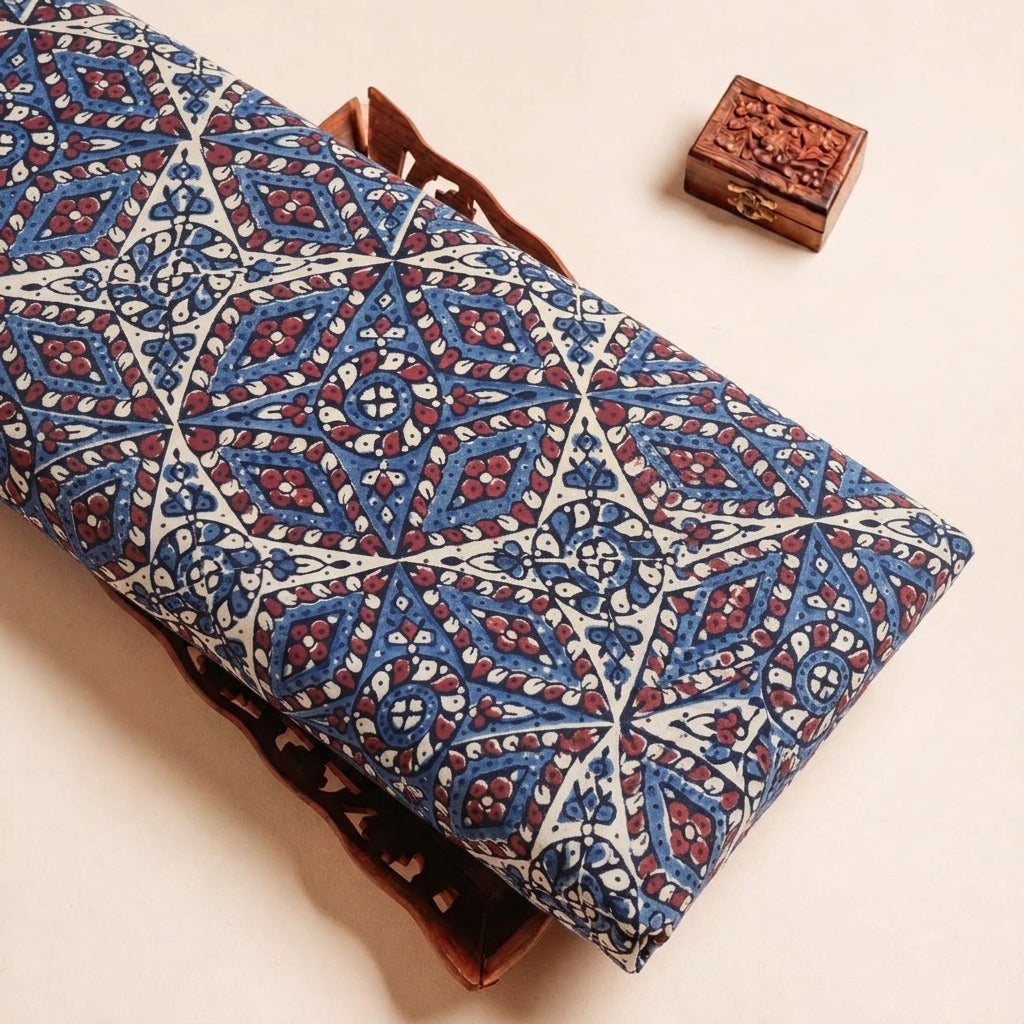 Folded Cream Ajrakh Modal Silk Fabric Highlighting Silk Block Print and Texture