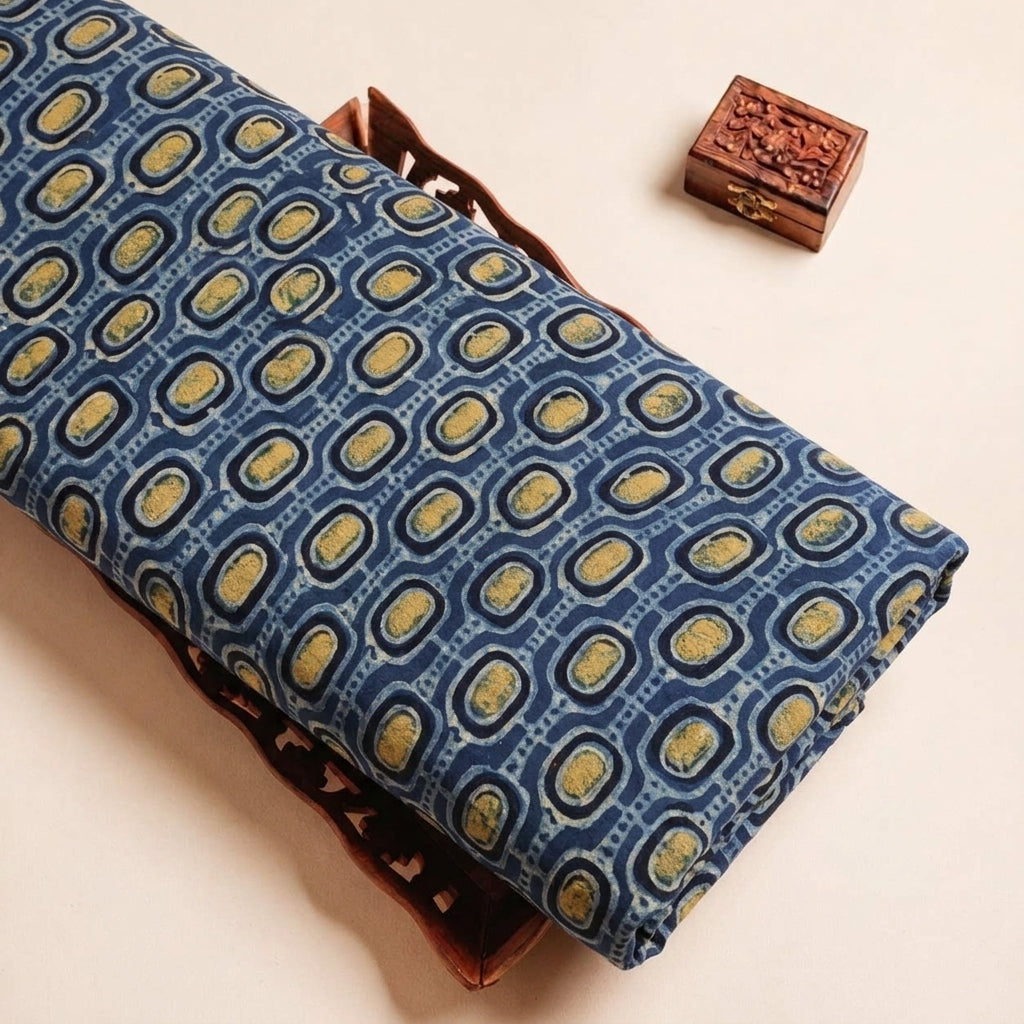 Folded Indigo Ajrakh Modal Silk Fabric Highlighting Silk Block Print and Texture