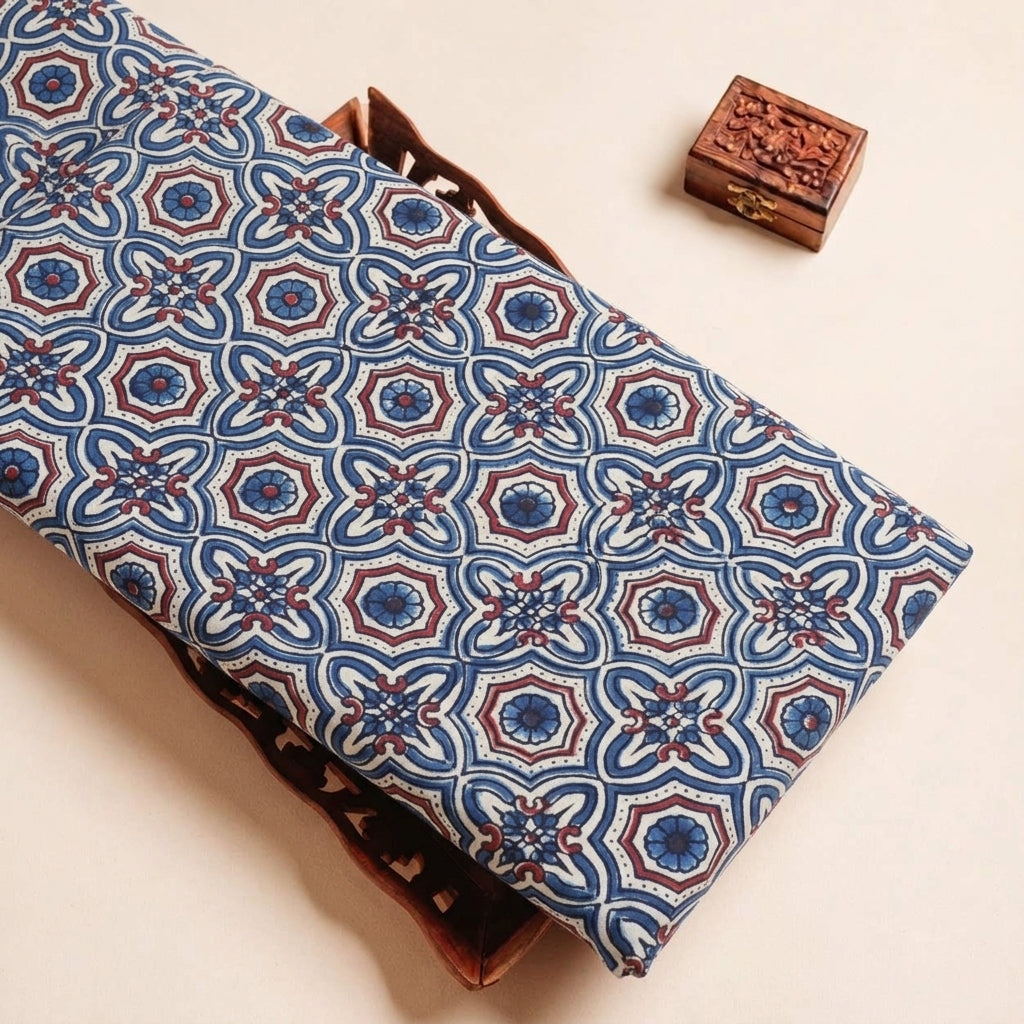 Folded Cream Ajrakh Modal Silk Fabric Highlighting Silk Block Print and Texture