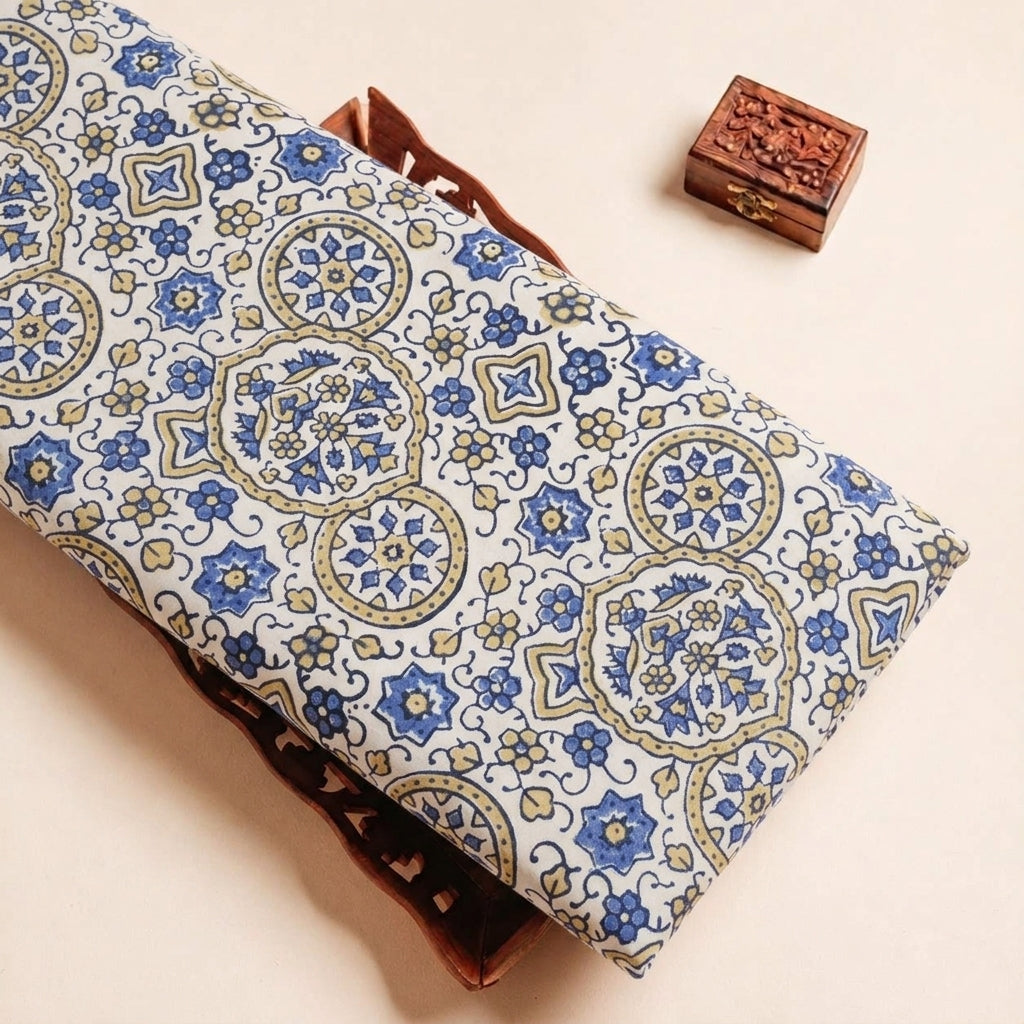 Folded Cream Ajrakh Modal Silk Fabric Highlighting Silk Block Print and Texture