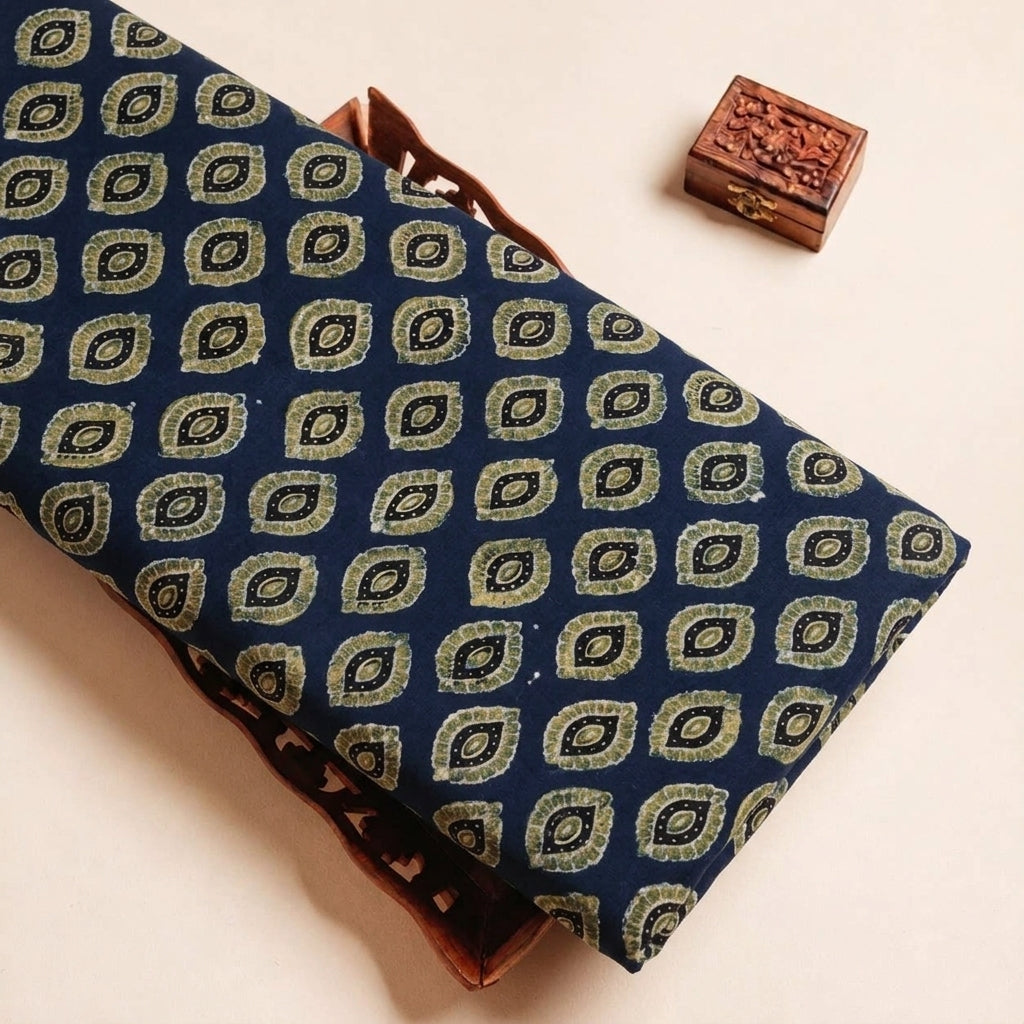 Folded Indigo Ajrakh Modal Silk Fabric Highlighting Silk Block Print and Texture