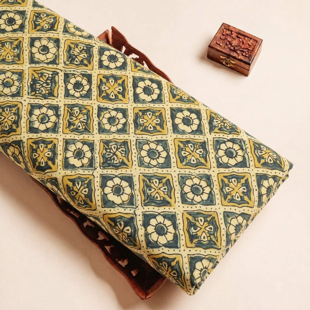 Folded Yellow Ajrakh Modal Silk Fabric Highlighting Floral Diamond Block Print and Texture
