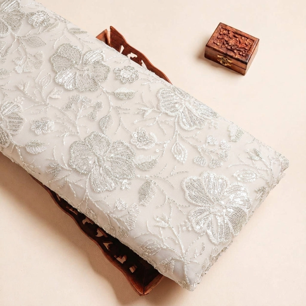 Folded Cream Embroidery Georgette Fabric Highlighting Sequin and Texture