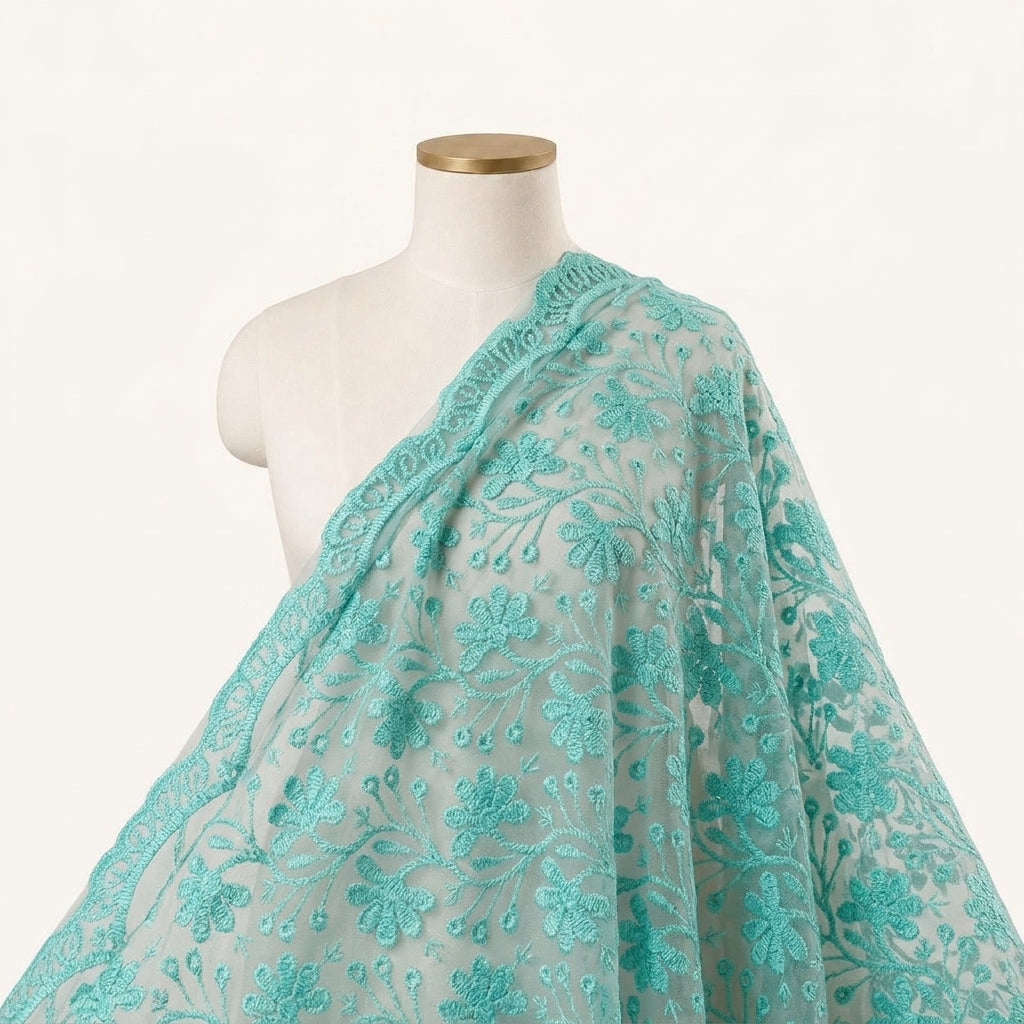 Embroidery Green Embroidery Lace Fabric Draped as a saree
