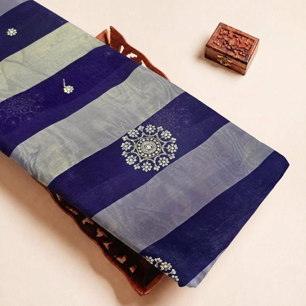 Folded Blue Embroidery Tissue Fabric Highlighting Stone Stripes and Texture