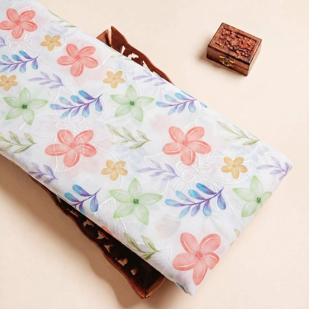 Folded White Embroidery Cotton Fabric Highlighting Floral Thread Work and Texture