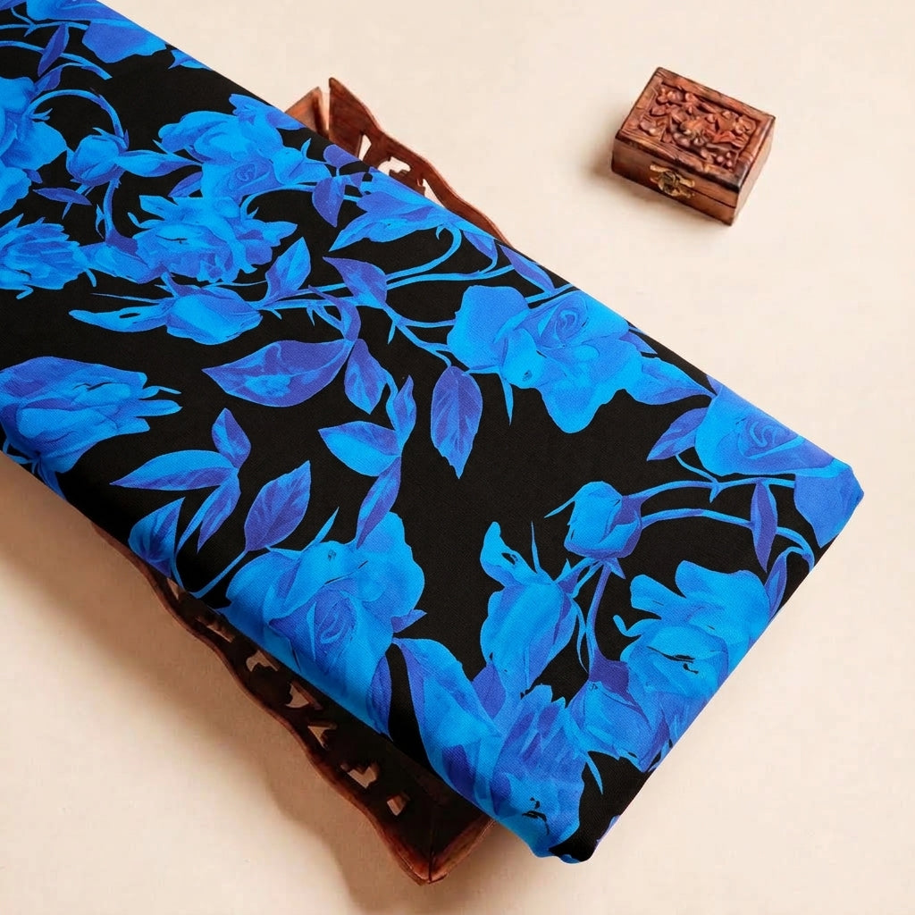 Folded Black Floral Satin Fabric Highlighting Modal and Texture